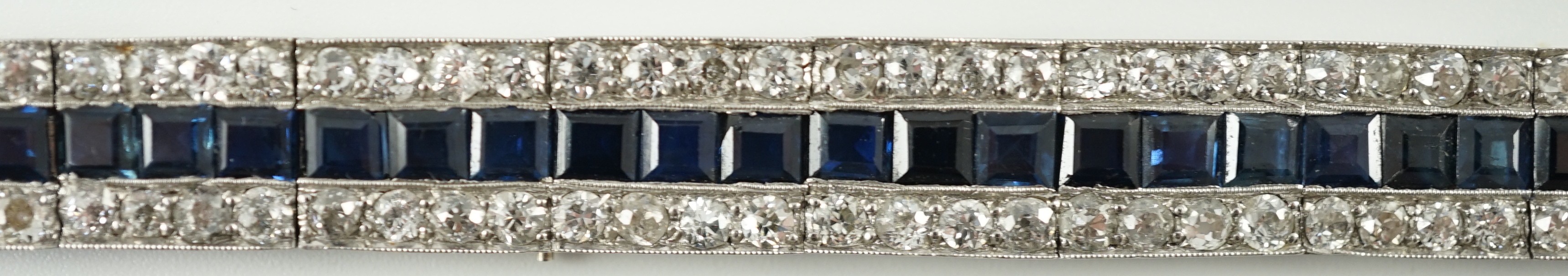 A 1920’s white gold, sapphire and diamond set triple line bracelet